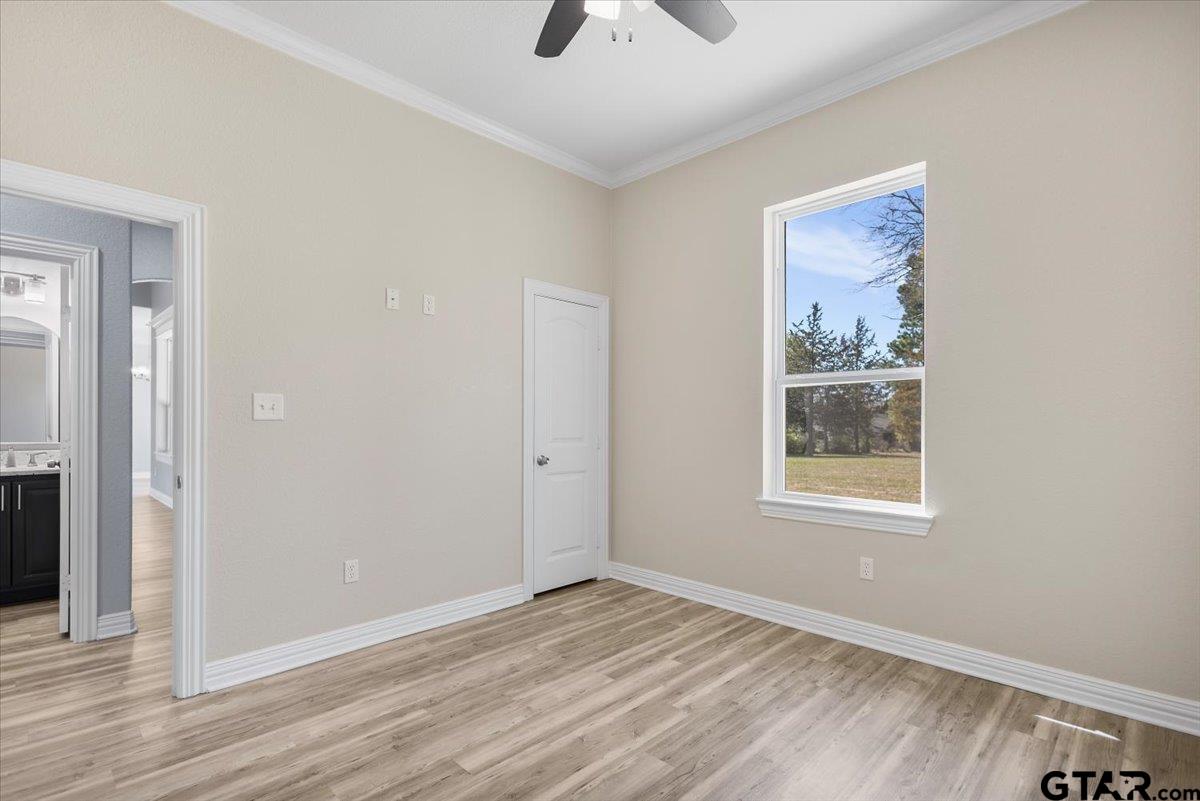 9629 Matise Street Tyler, TX 75706 - Photo 33 of 48 wooden floor in an empty room with a window