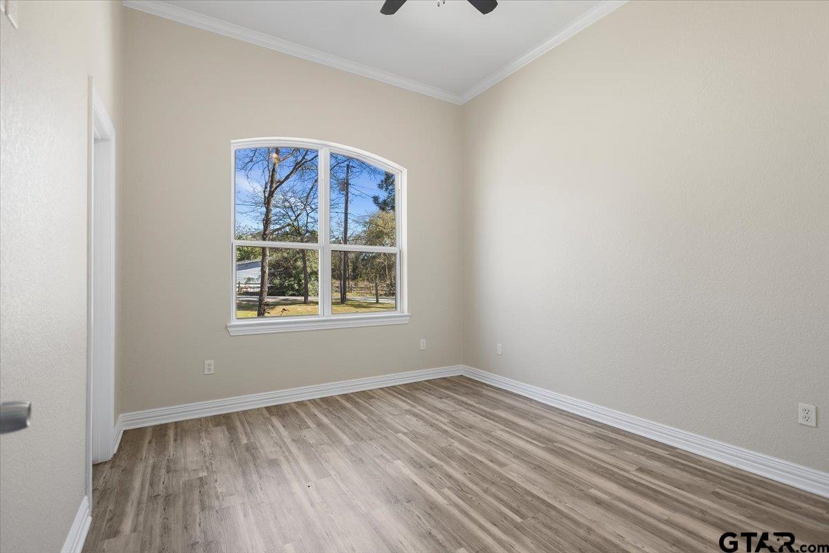 9629 Matise Street Tyler, TX 75706 - Photo 40 of 48 wooden floor in an empty room with a window