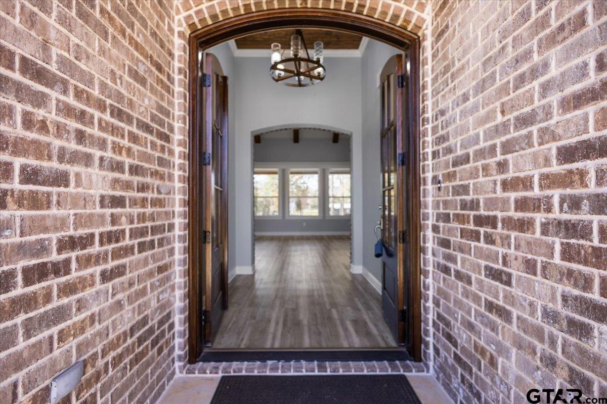 9629 Matise Street Tyler, TX 75706 - Photo 4 of 48 a view of a hallway with wooden door