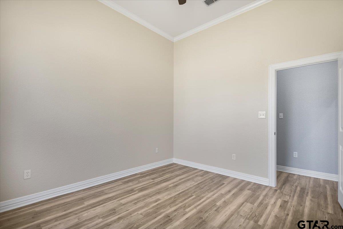 9629 Matise Street Tyler, TX 75706 - Photo 42 of 48 a view of an empty room with wooden floor and closet