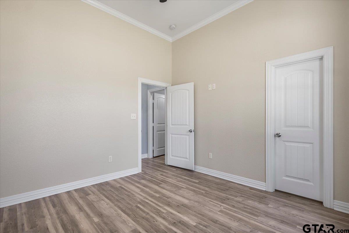 9629 Matise Street Tyler, TX 75706 - Photo 43 of 48 a view of an empty room with wooden floor
