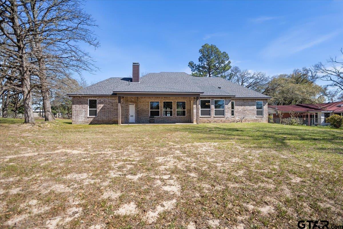 9629 Matise Street Tyler, TX 75706 - Photo 46 of 48 a front view of a house with a garden