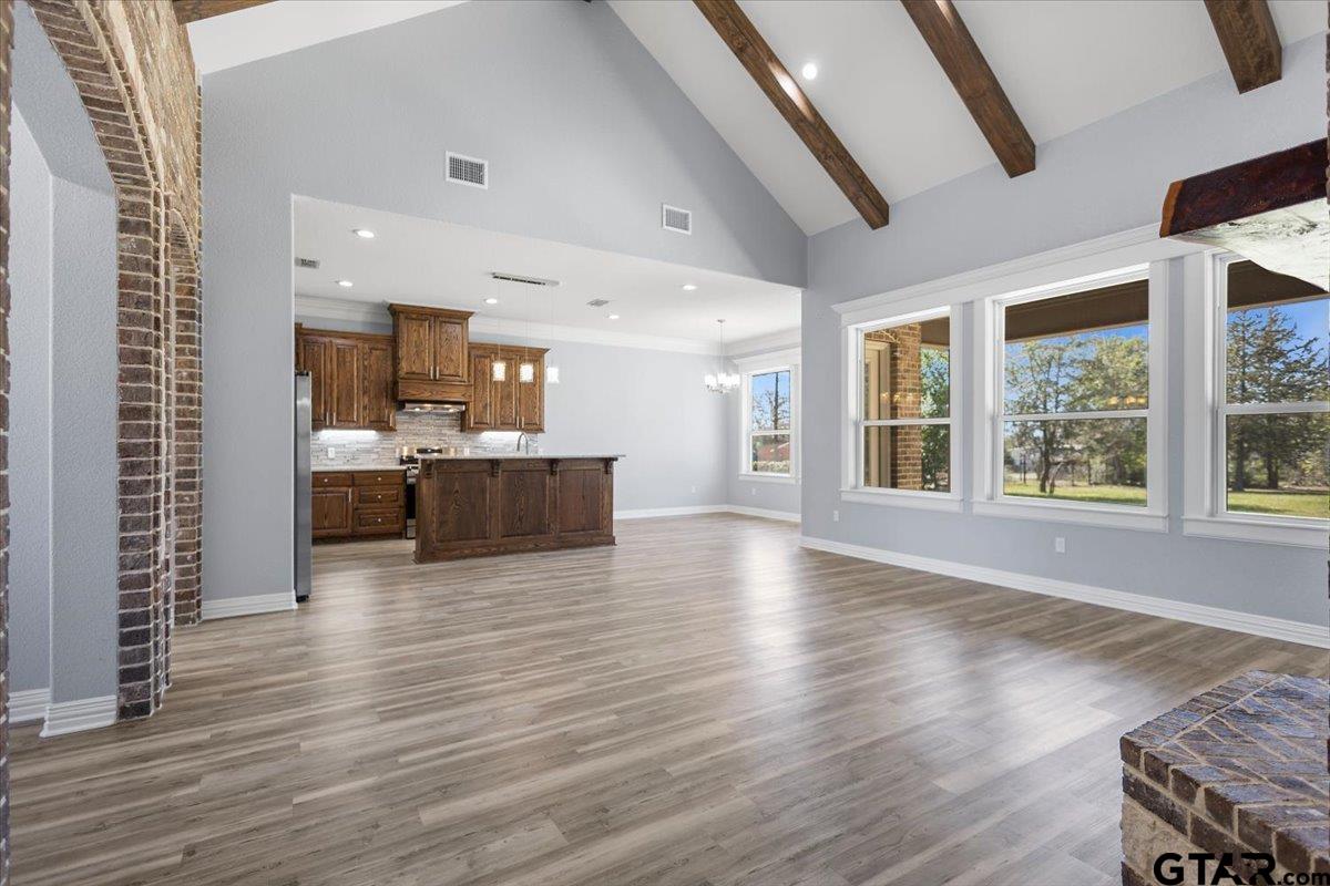 9629 Matise Street Tyler, TX 75706 - Photo 5 of 48 a view of kitchen and kitchen with furniture wooden floor and window