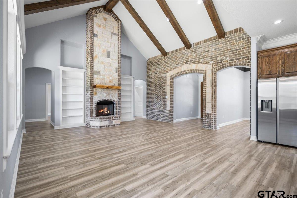 9629 Matise Street Tyler, TX 75706 - Photo 8 of 48 a view of livingroom and fireplace with wooden floor