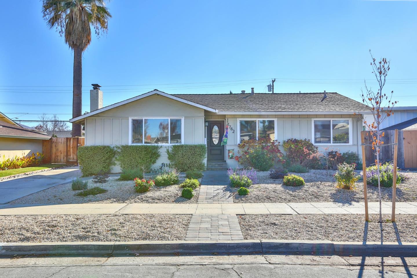 a front view of a house with garden
