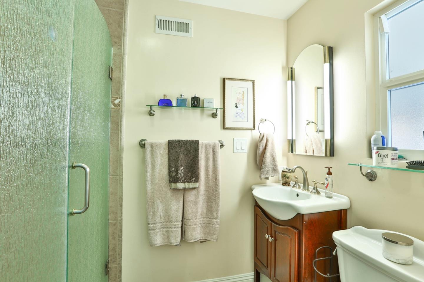 1762 Hallmark Lane San Jose, CA 95124 - Photo 16 of 39 a bathroom with a sink toilet and shower