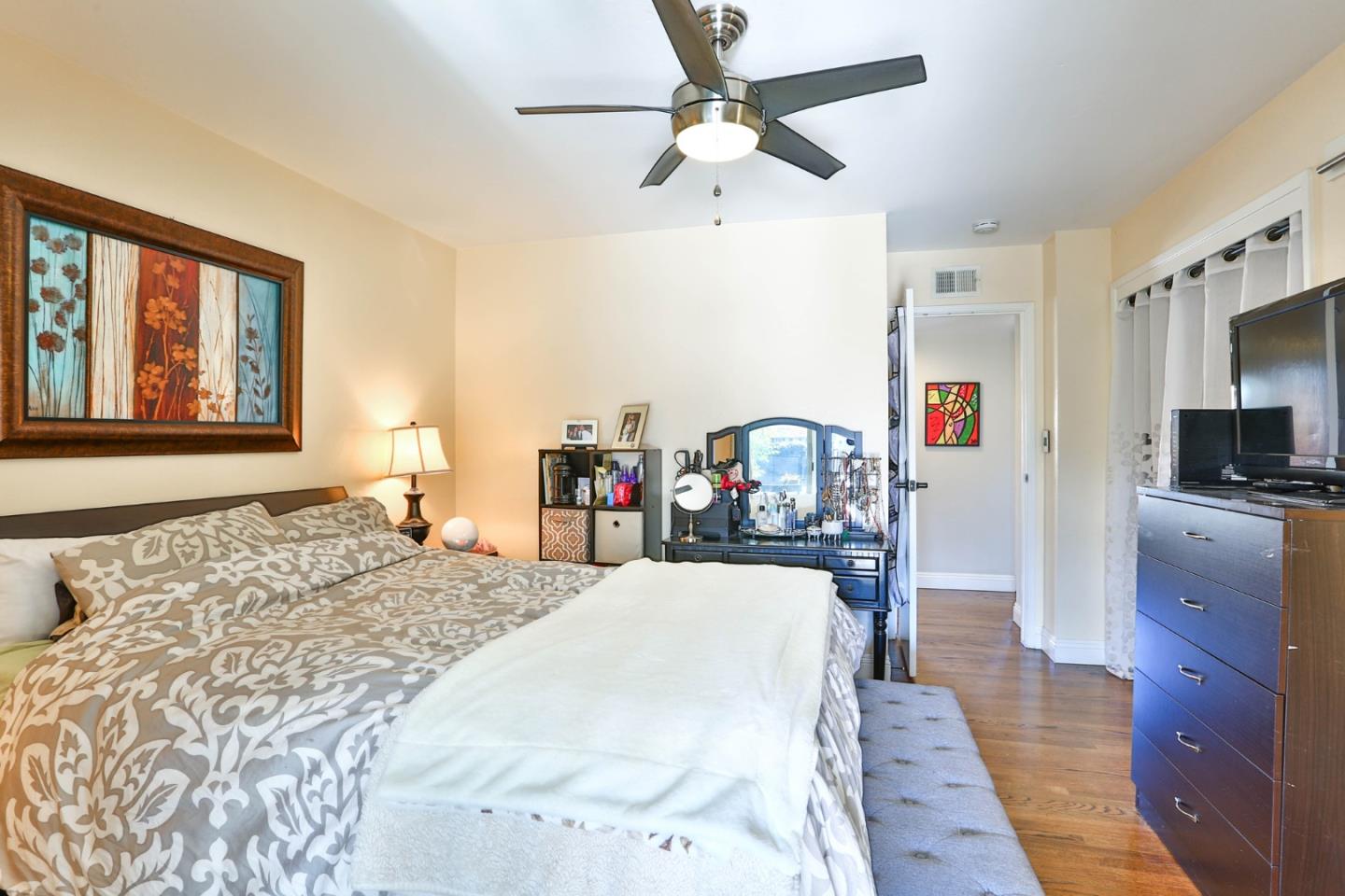 1762 Hallmark Lane San Jose, CA 95124 - Photo 18 of 39 a bed room with a bed mirror and a window
