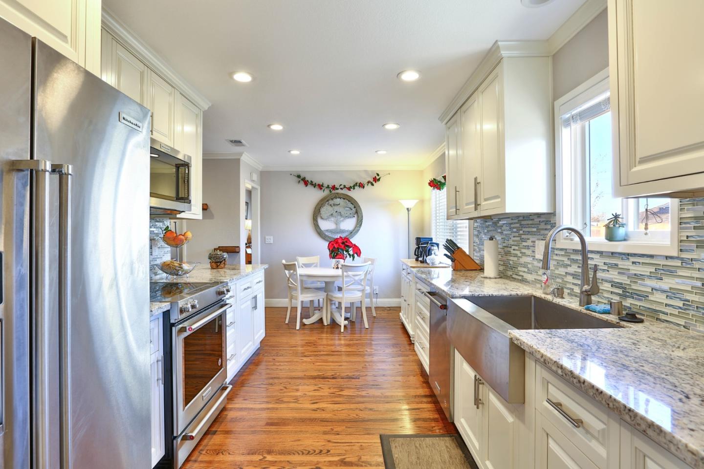 1762 Hallmark Lane San Jose, CA 95124 - Photo 3 of 39 a kitchen with granite countertop lots of counter top space stainless steel appliances and wooden floor