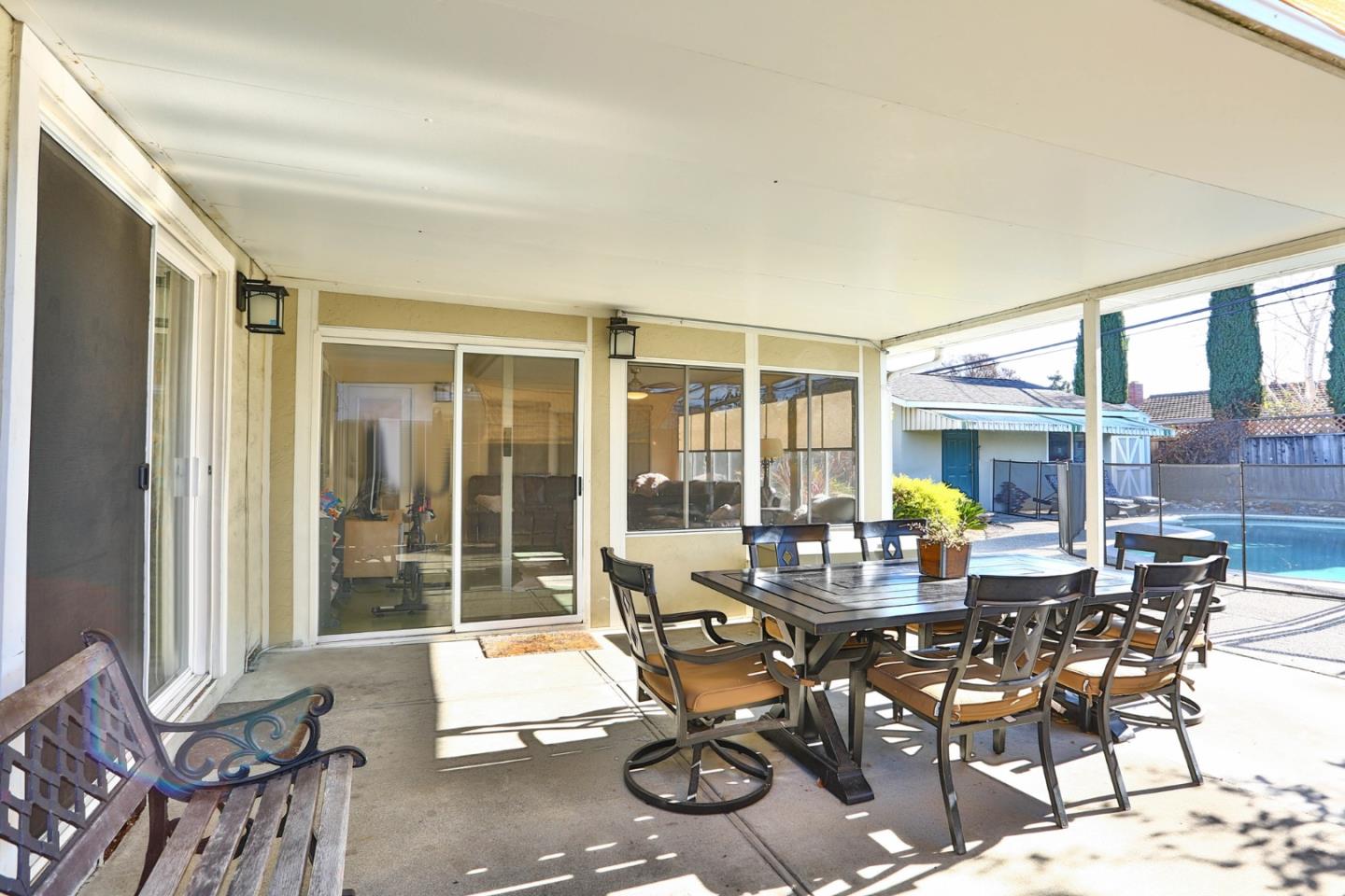 1762 Hallmark Lane San Jose, CA 95124 - Photo 23 of 39 a view of a dining room with furniture wooden floor and a chandelier