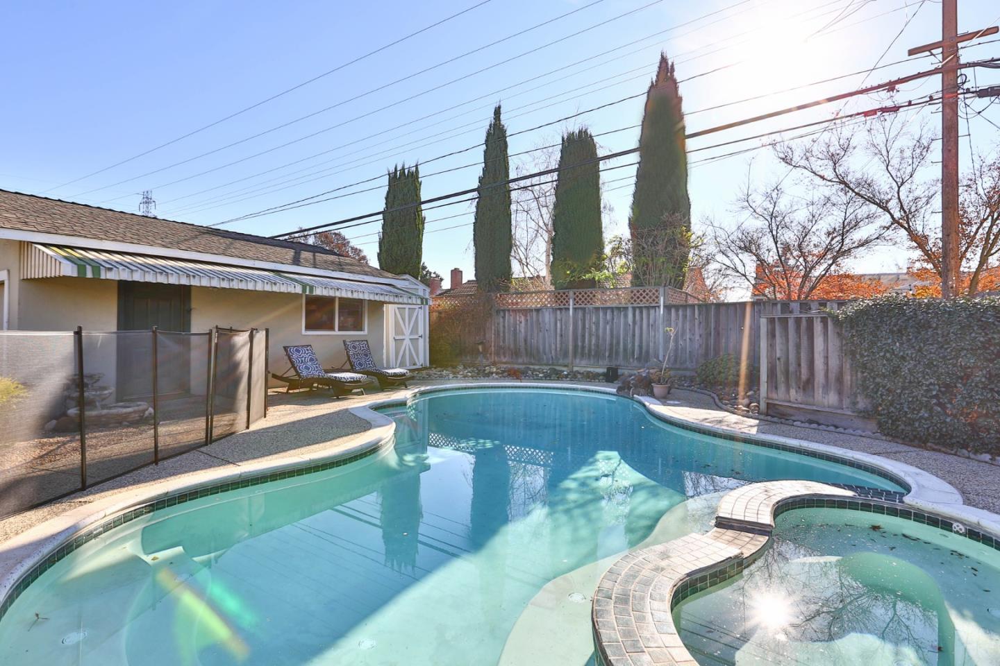 1762 Hallmark Lane San Jose, CA 95124 - Photo 30 of 39 a swimming pool with outdoor seating and yard