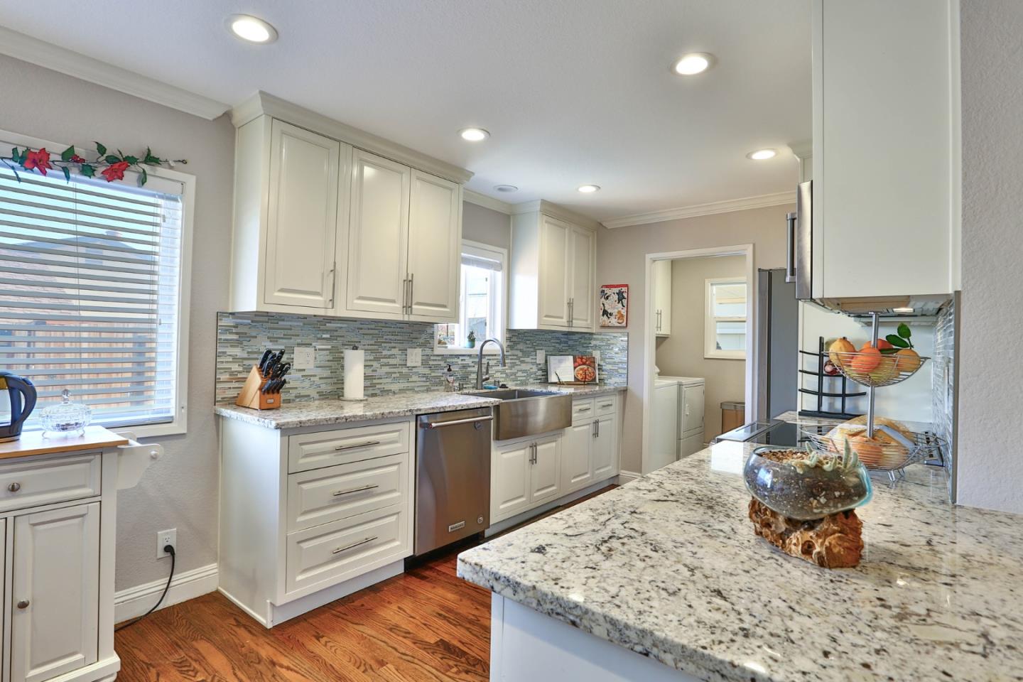 1762 Hallmark Lane San Jose, CA 95124 - Photo 4 of 39 a kitchen with stainless steel appliances kitchen island granite countertop a sink and cabinets