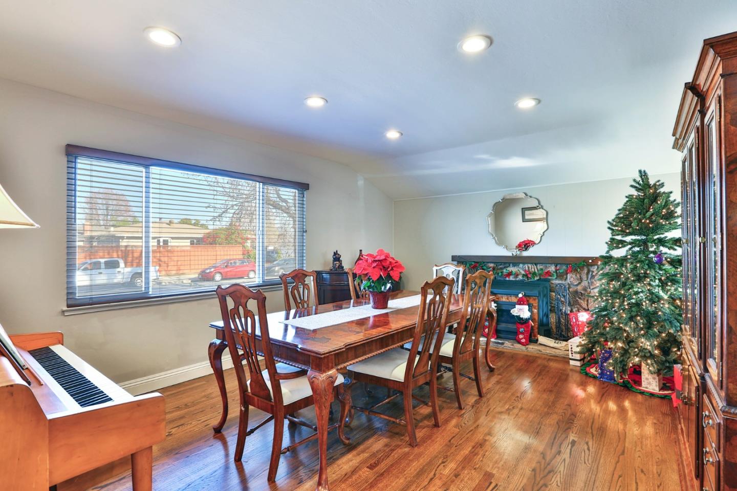 1762 Hallmark Lane San Jose, CA 95124 - Photo 9 of 39 a view of a dining room with furniture a chandelier and wooden floor
