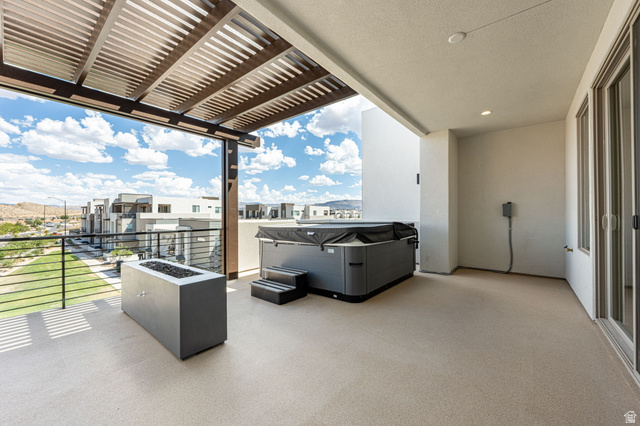 684 West High Tide Place, Unit 131 St. George, UT 84790 - Photo 20 of 27 Spacious outdoor patio featuring a slatted pergola, integrated fire pit, and an outdoor spa with steps
