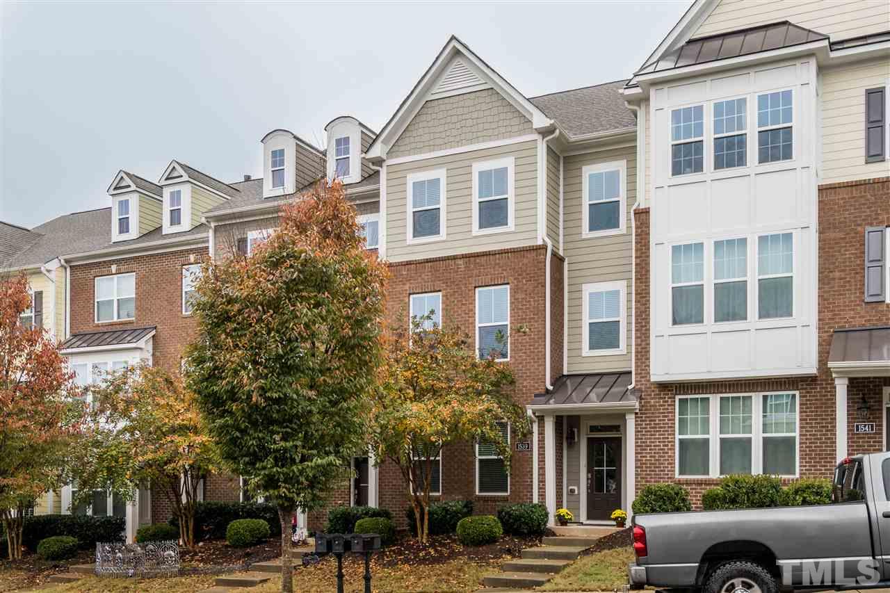 1539 Rodessa Run Raleigh, NC 27607 - Photo 2 of 25 a front view of a building with lot of cars and trees