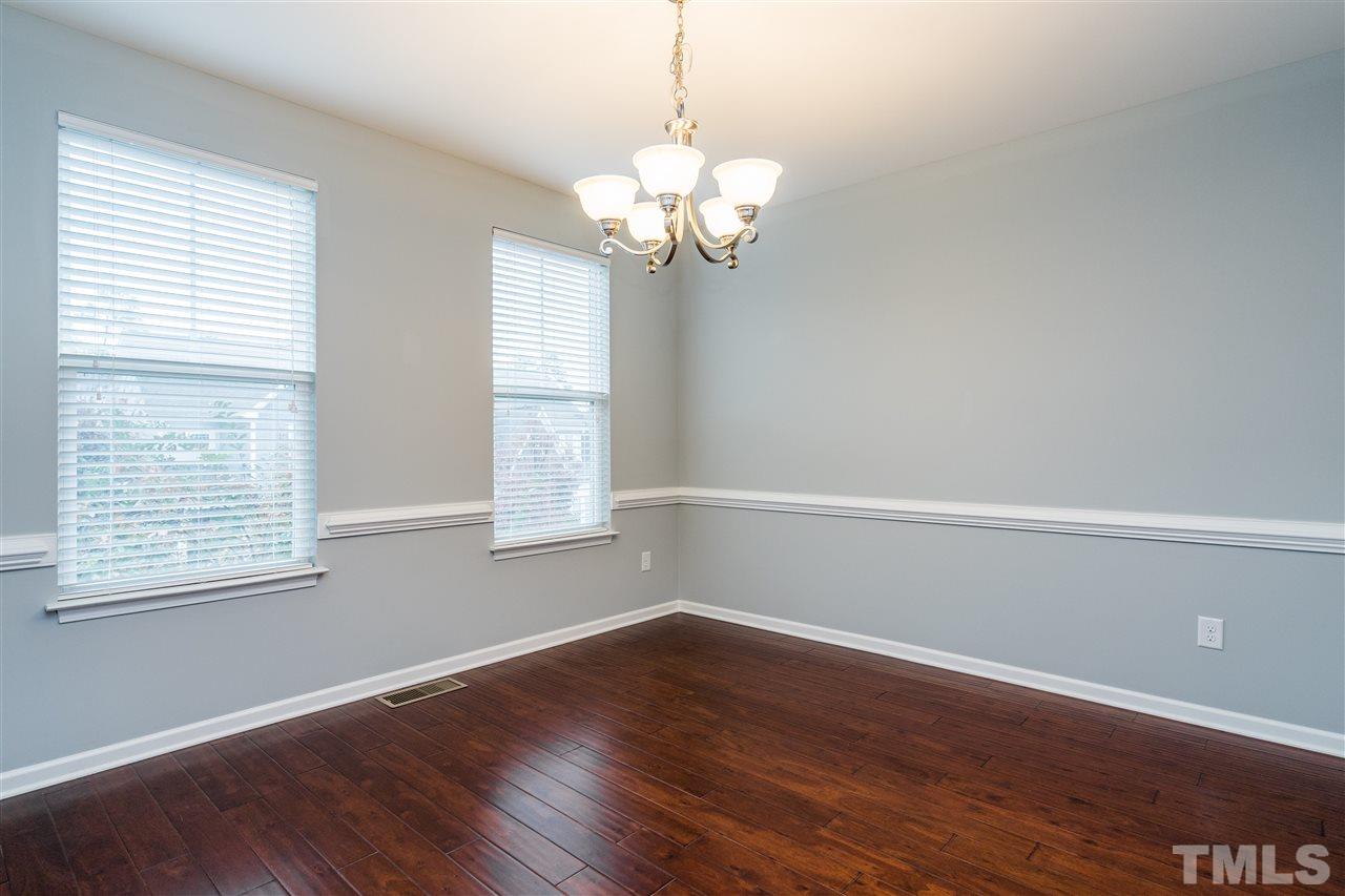 1539 Rodessa Run Raleigh, NC 27607 - Photo 10 of 25 a view of a room with wooden floor and a window
