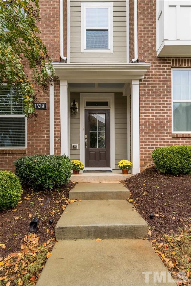 1539 Rodessa Run Raleigh, NC 27607 - Photo 3 of 25 a view of brick building with potted plants