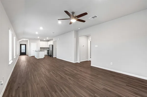 a view of kitchen and livingroom with wooden floor