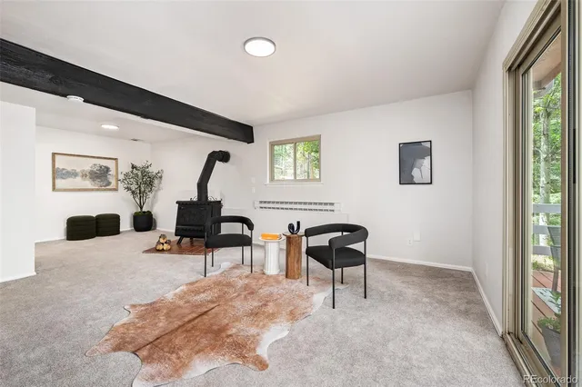 a bedroom with furniture and a window