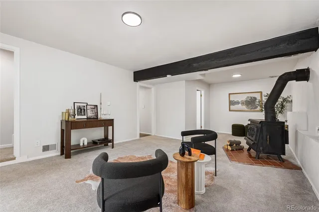 a bedroom with furniture and a mirror