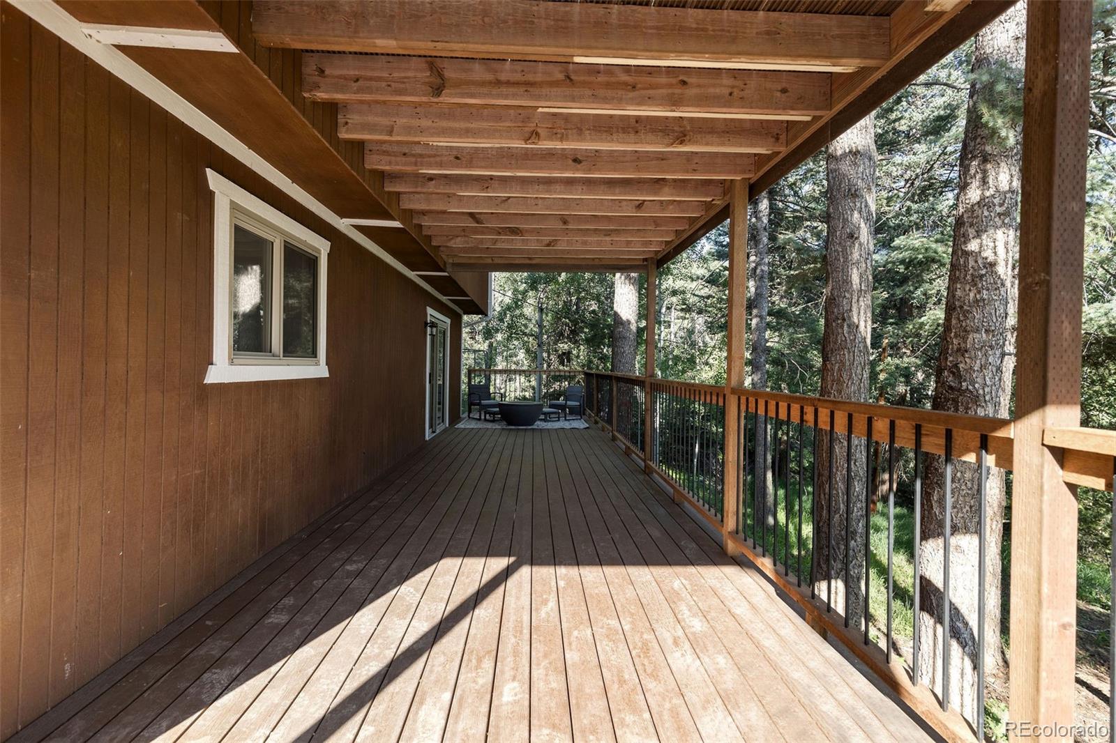 19424 Silver Ranch Road Conifer, CO 80433 - Photo 29 of 43 a view of balcony with a wooden floor
