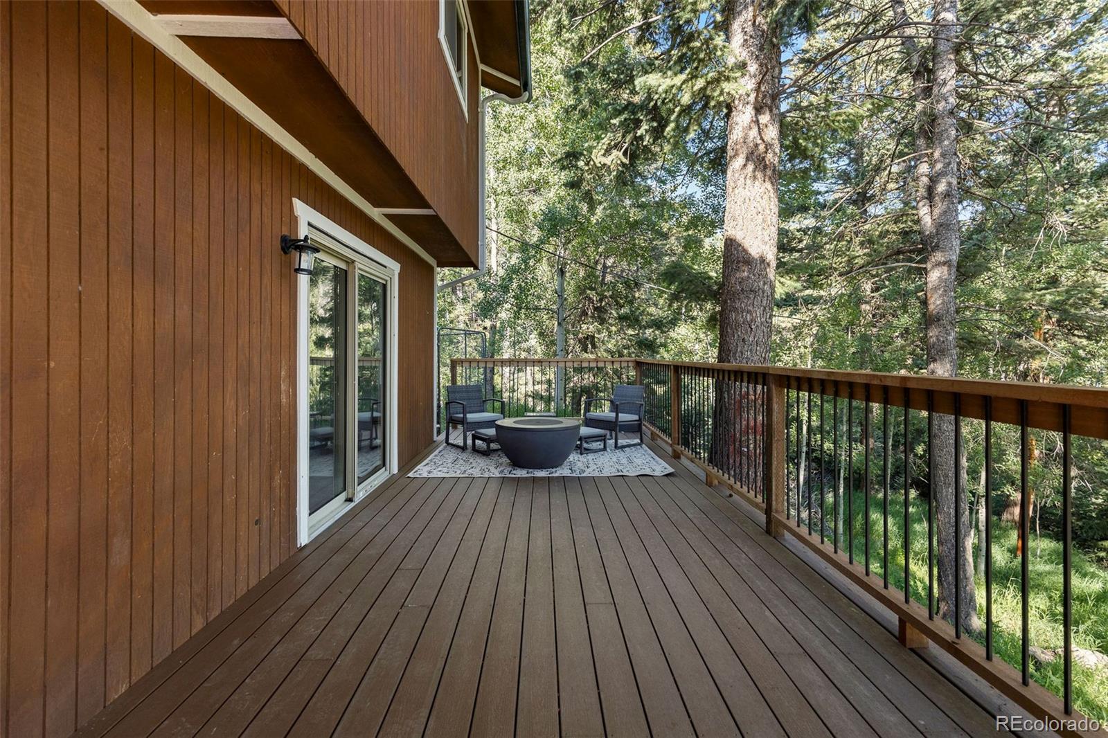 19424 Silver Ranch Road Conifer, CO 80433 - Photo 30 of 43 a view of balcony with wooden floor and fence