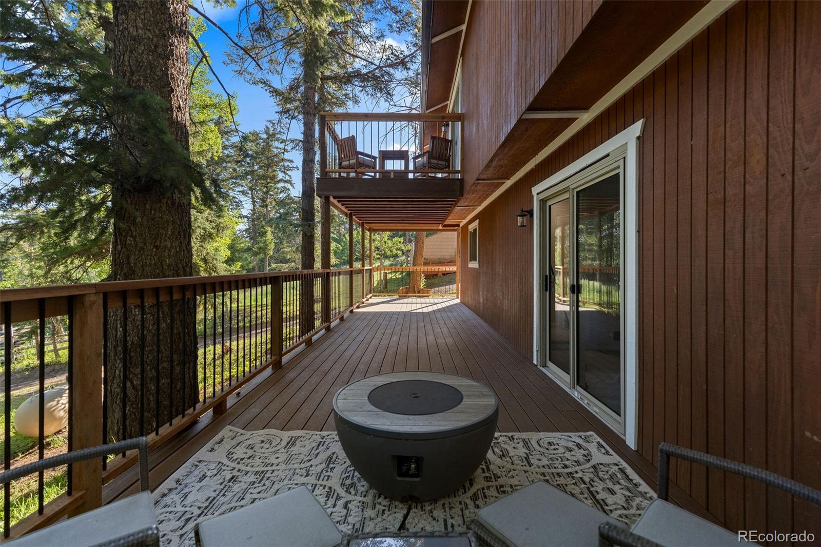 19424 Silver Ranch Road Conifer, CO 80433 - Photo 32 of 43 a view of a balcony with furniture
