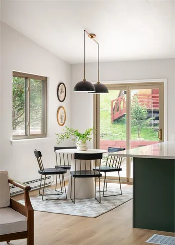 a view of a dining room with furniture window and outside view