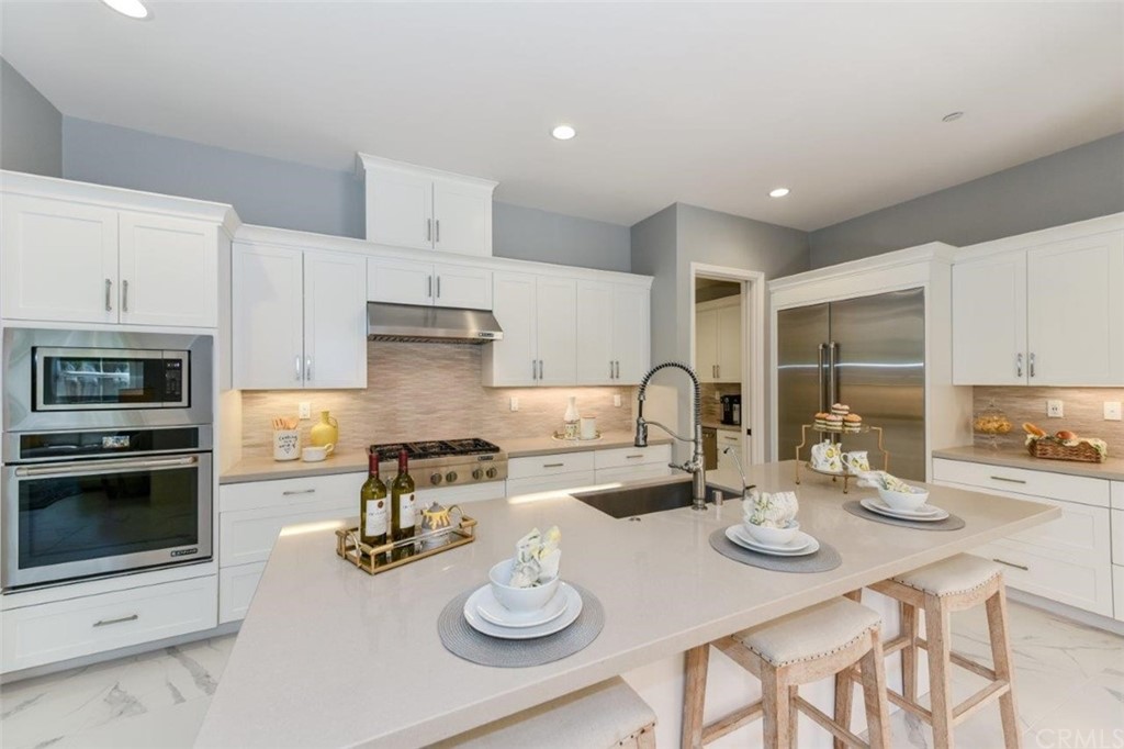 134 Paxton Irvine, CA 92620 - Photo 13 of 51 a kitchen with sink refrigerator and stove
