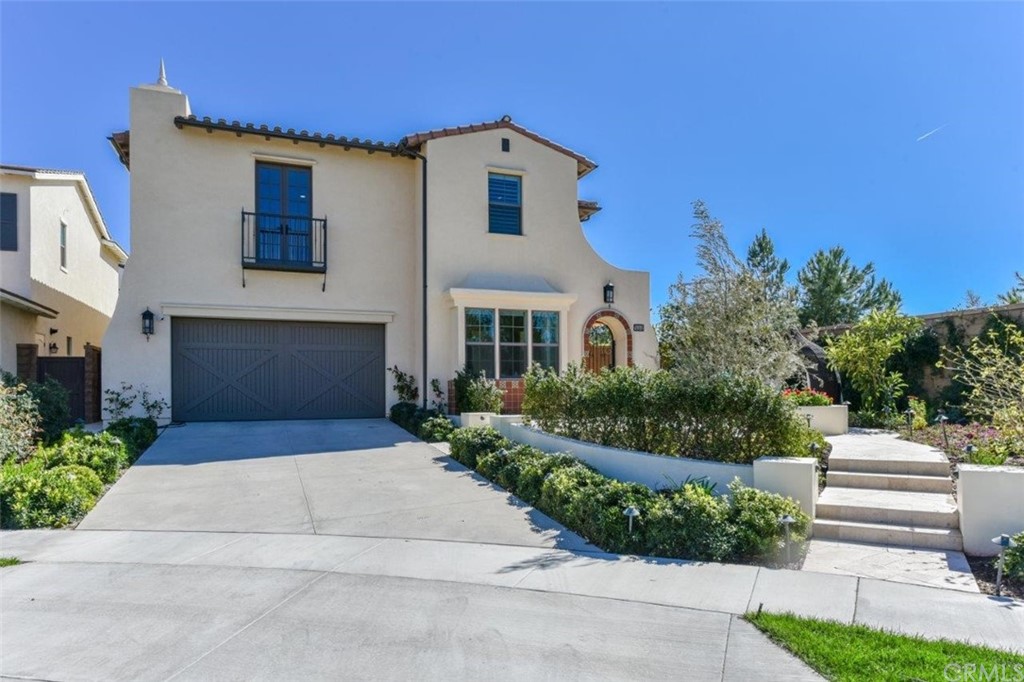134 Paxton Irvine, CA 92620 - Photo 2 of 51 a front view of a house with a yard and garage