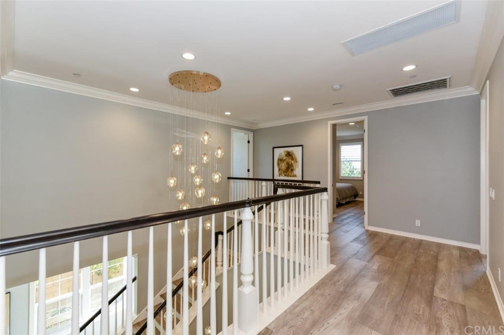 134 Paxton Irvine, CA 92620 - Photo 22 of 51 a view of a hallway with wooden floor