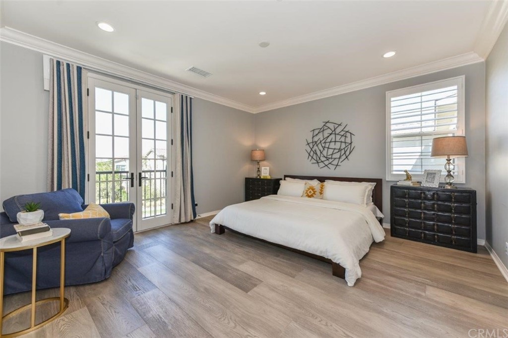 134 Paxton Irvine, CA 92620 - Photo 31 of 51 a bedroom with a bed and wooden floor