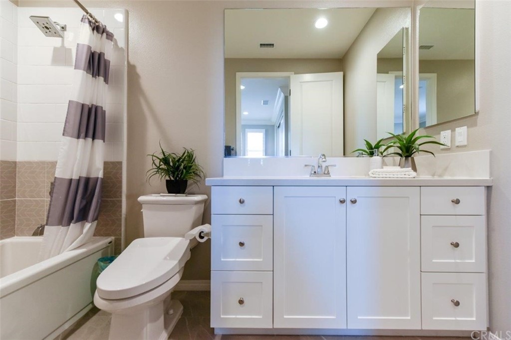 134 Paxton Irvine, CA 92620 - Photo 34 of 51 a bathroom with a sink a toilet a tub and mirror