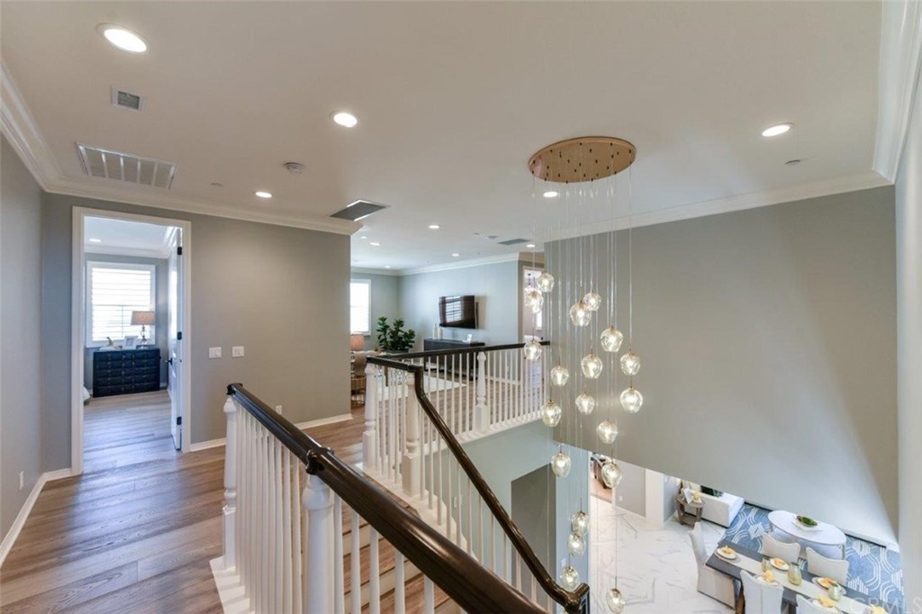 134 Paxton Irvine, CA 92620 - Photo 36 of 51 a view of a hallway with furniture and wooden floor