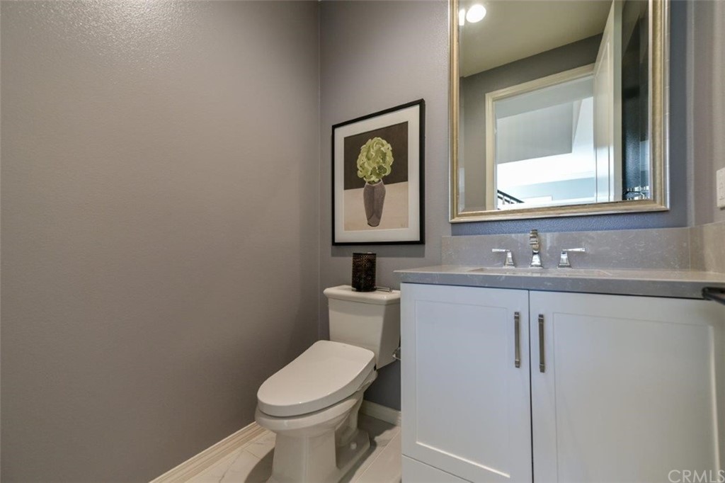 134 Paxton Irvine, CA 92620 - Photo 37 of 51 a bathroom with a toilet sink and mirror
