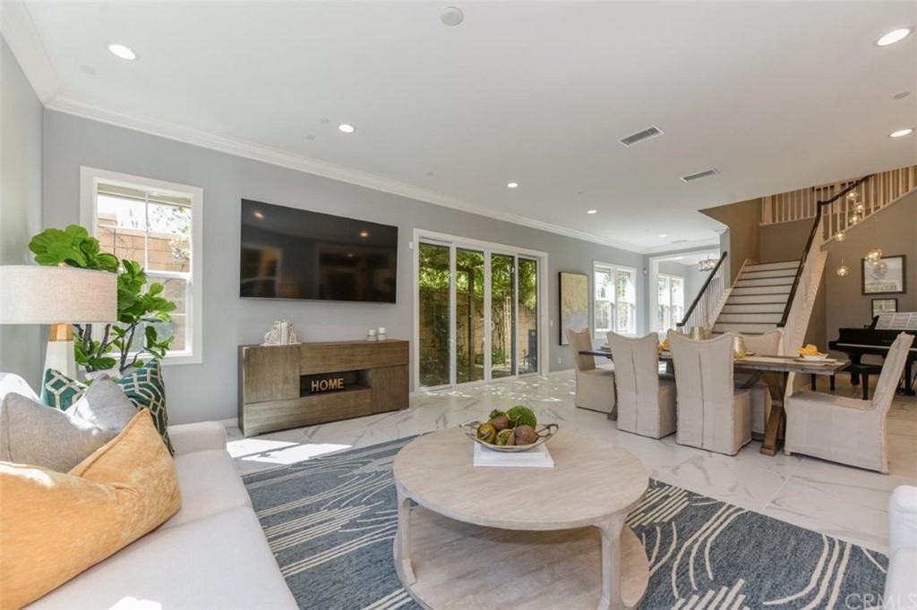 134 Paxton Irvine, CA 92620 - Photo 10 of 51 a living room with furniture flat screen tv and a fireplace