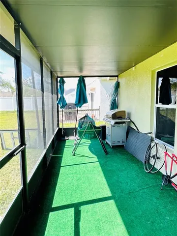 a room with chairs and a large window