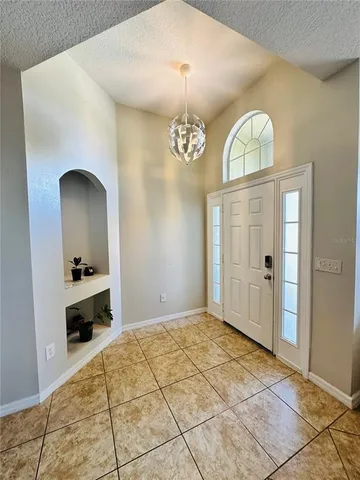 a bedroom with a bed and a mirror