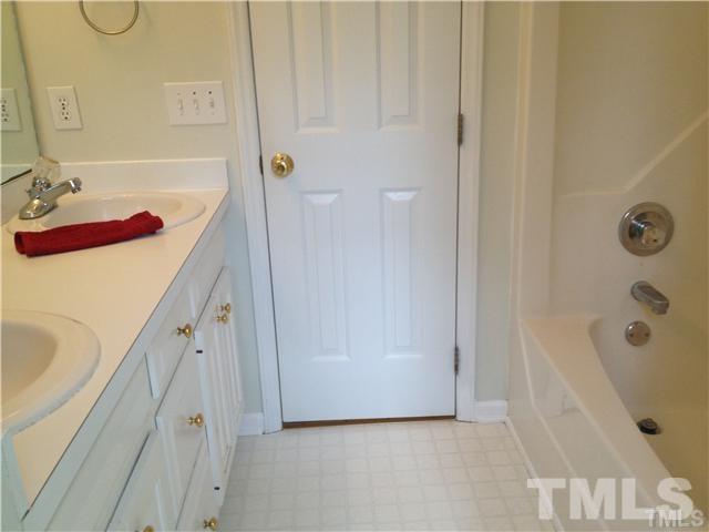 6299 Wimberly Road Willow Spring, NC 27592 - Photo 14 of 25 a bathroom with a tub sink and mirror