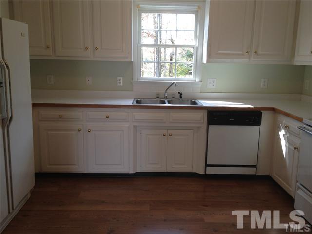 6299 Wimberly Road Willow Spring, NC 27592 - Photo 8 of 25 a kitchen with a cabinets window and cabinets