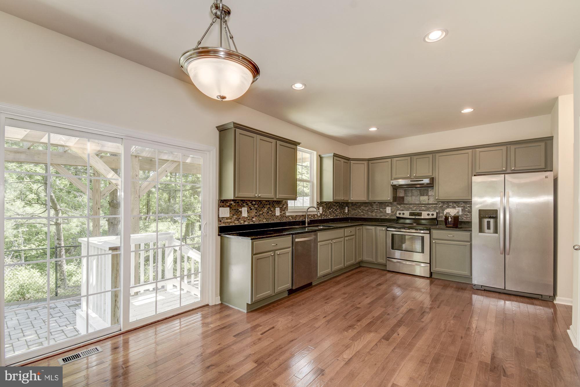 1695 Lottie Fowler Road Prince Frederick, MD 20678 - Photo 14 of 42 Kitchen Adorned with Stainless Appliances