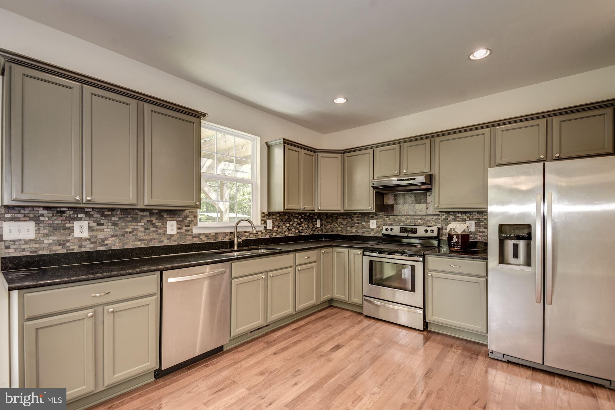1695 Lottie Fowler Road Prince Frederick, MD 20678 - Photo 16 of 42 Light Sage Green Cabinetry and Granite Countertops