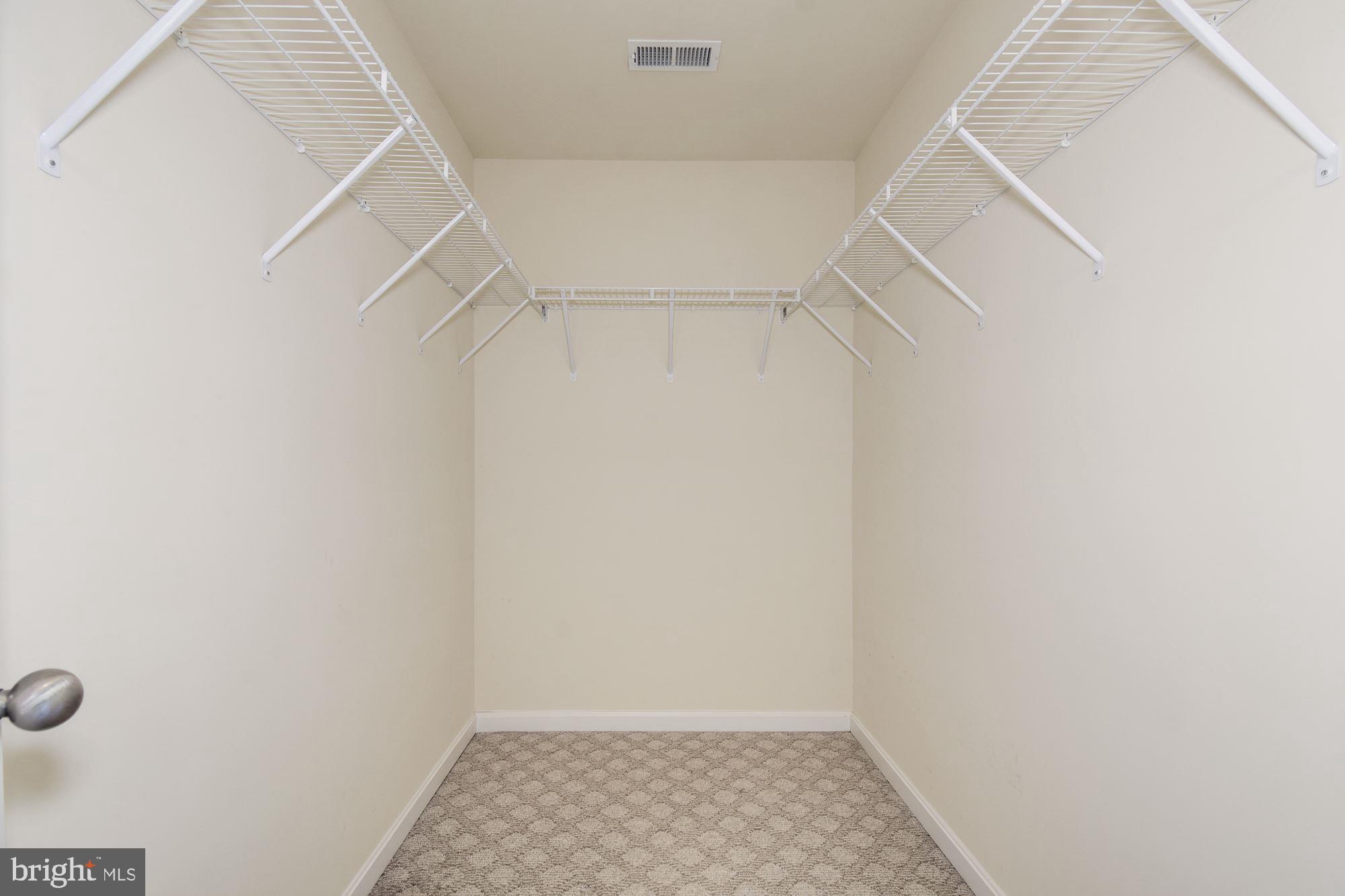 1695 Lottie Fowler Road Prince Frederick, MD 20678 - Photo 26 of 42 Owner's Suite Walk-In Closet for Plenty of Storage