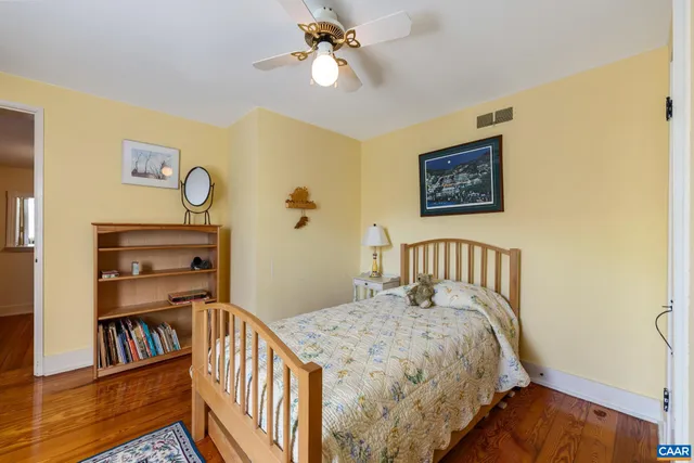 a bedroom with a bed and a fireplace
