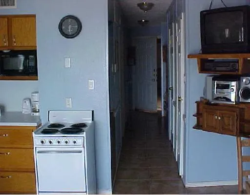 a kitchen with a stove and a refrigerator