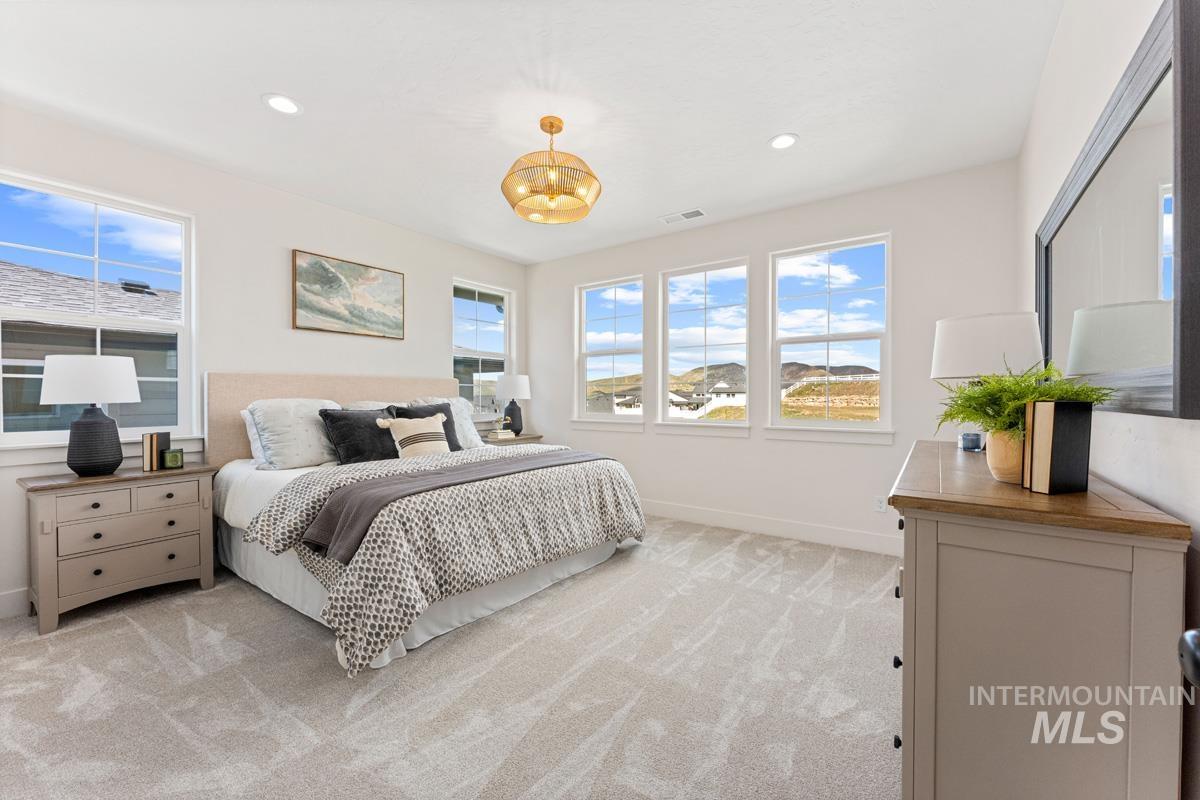 13374 North Spring Creek Way Boise, ID 83714 - Photo 14 of 49 Bedroom featuring light colored carpet and recessed lighting
