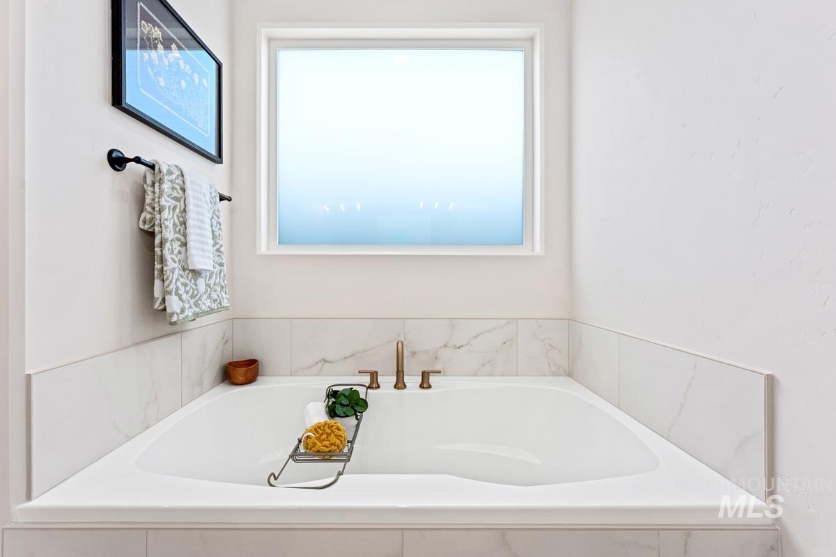 13374 North Spring Creek Way Boise, ID 83714 - Photo 18 of 49 Bathroom featuring a garden tub