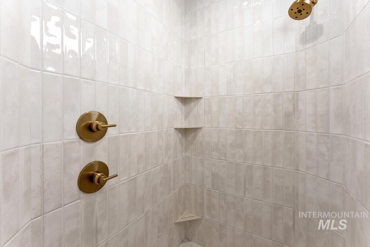 13374 North Spring Creek Way Boise, ID 83714 - Photo 19 of 49 Bathroom view of a tile shower
