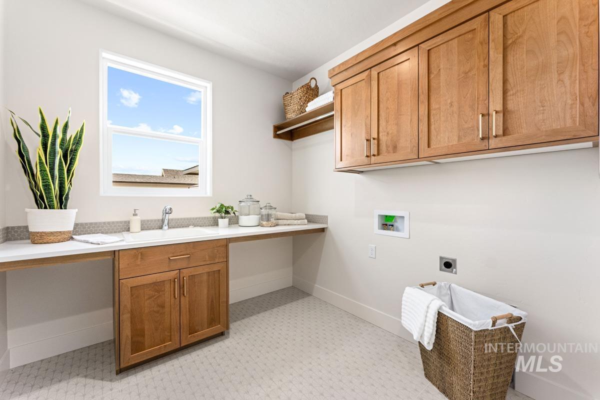 13374 North Spring Creek Way Boise, ID 83714 - Photo 33 of 49 Laundry room with hookup for a washing machine, cabinet space, and electric dryer hookup