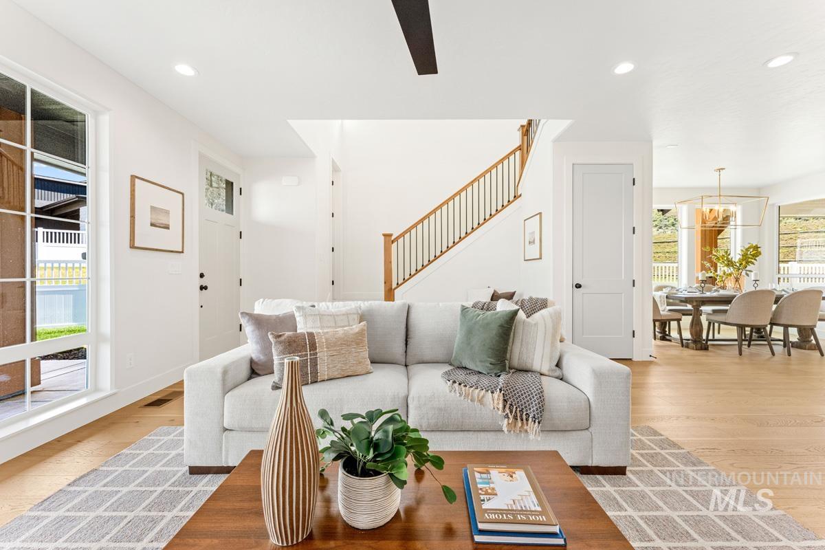 13374 North Spring Creek Way Boise, ID 83714 - Photo 4 of 49 Living area with light wood finished floors, recessed lighting, and a ceiling fan
