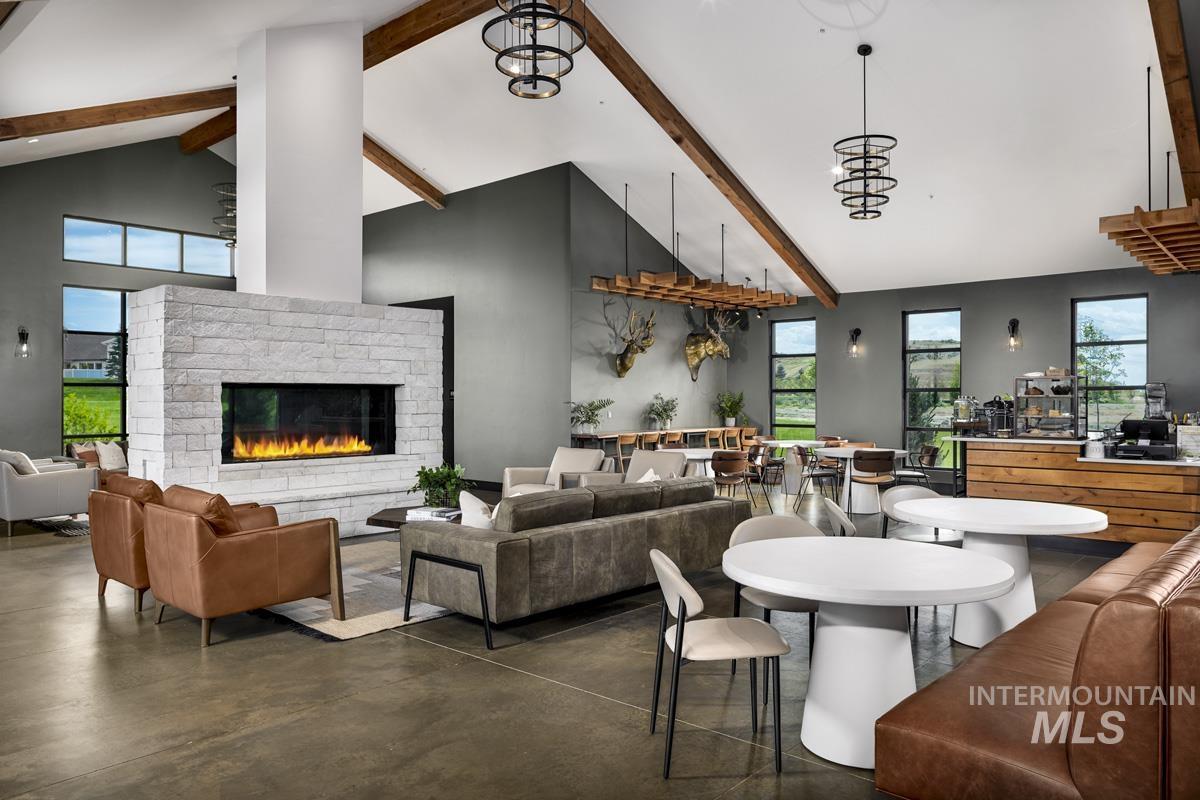 13374 North Spring Creek Way Boise, ID 83714 - Photo 45 of 49 Dining area with concrete flooring and a brick fireplace